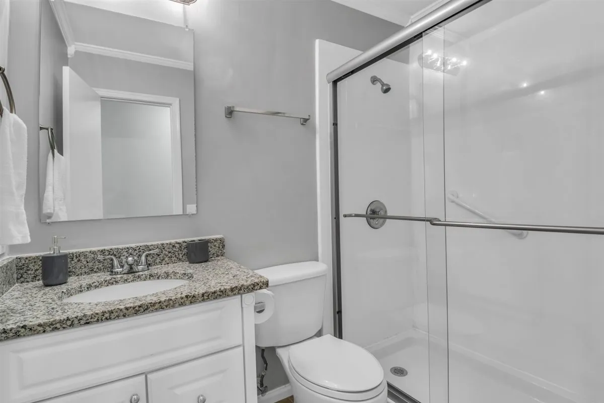 The full bath is located in the hallway between the 3 bedrooms. Everyone's favorite amenity is the heated toilet seat with 3 different heat levels to choose your own comfort! There is one in each bathroom.