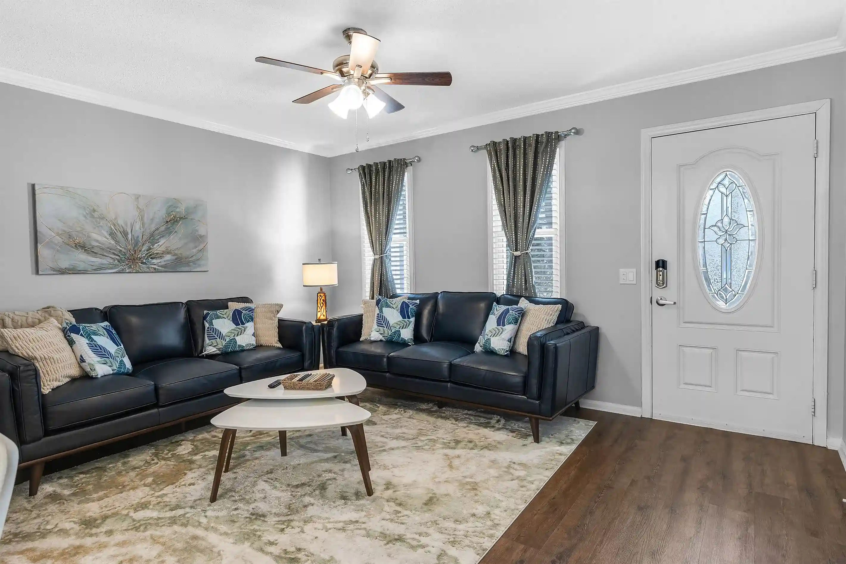 Relax in style in the living room, featuring two cozy leather couches perfect for unwinding after a day of adventure.