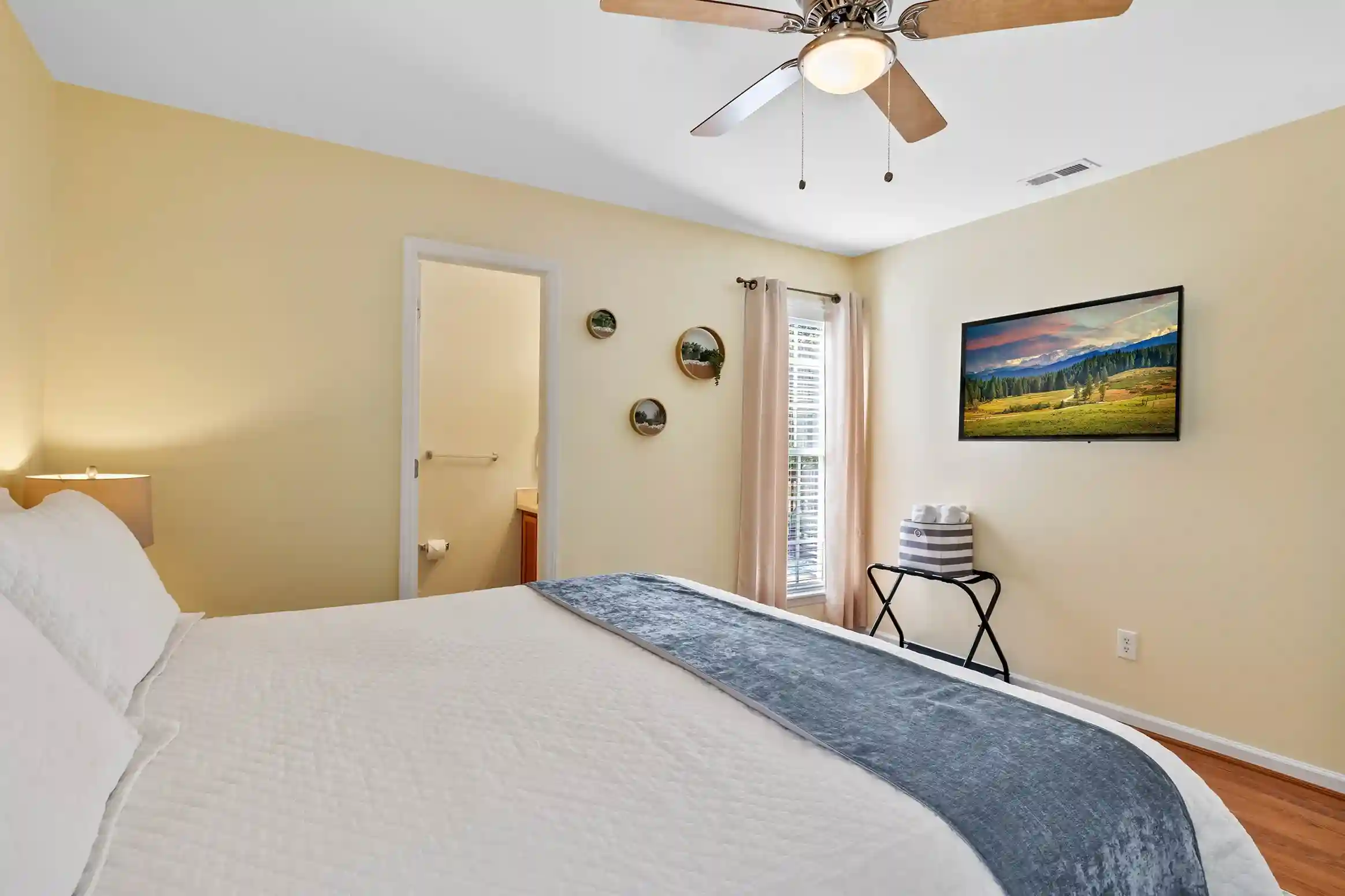 The master bedroom features a king size bed, en suite bathroom, smart tv and walk-in closet.