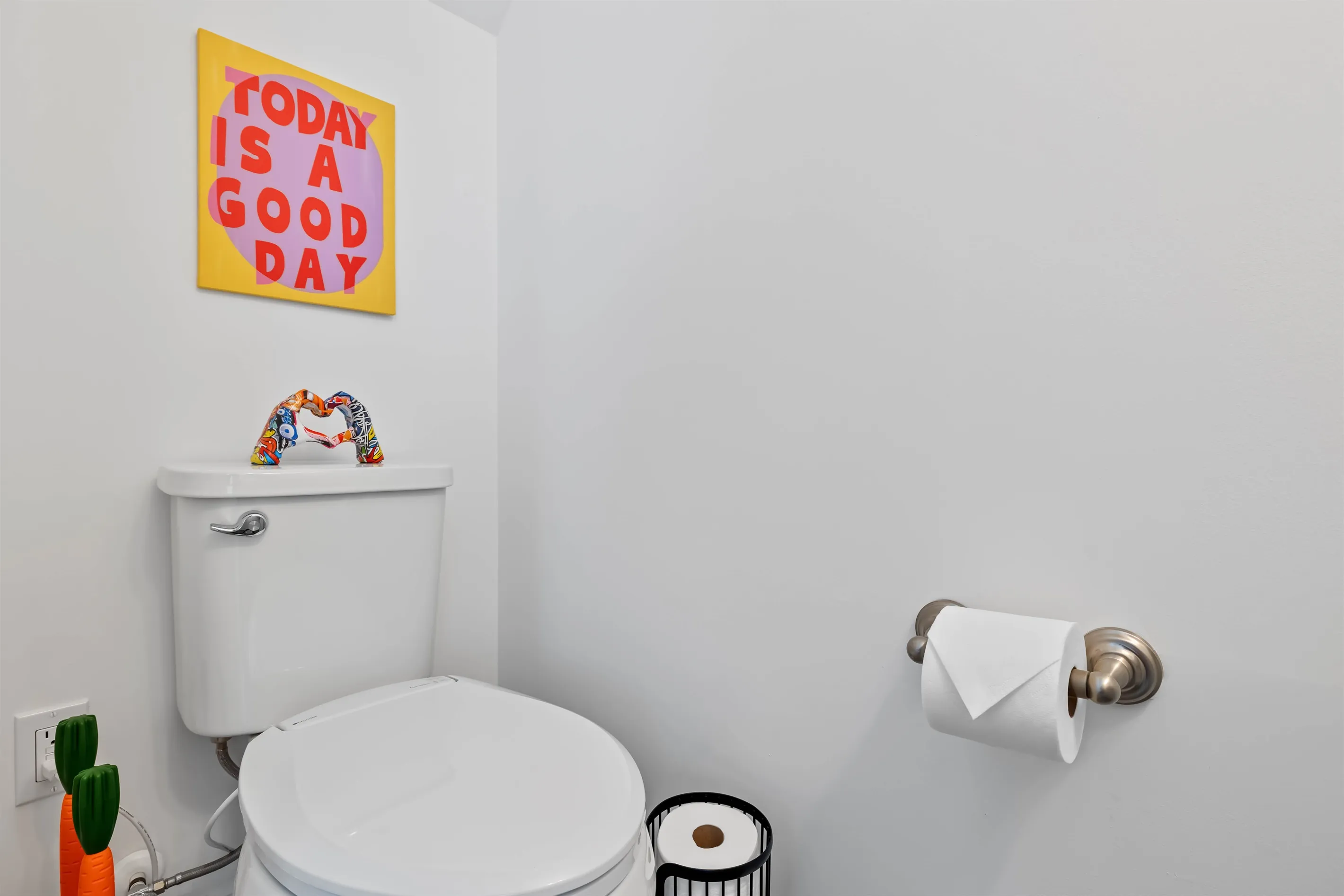 Half bath downstairs with a heated toilet seat that guests always rave about in the sister properties.