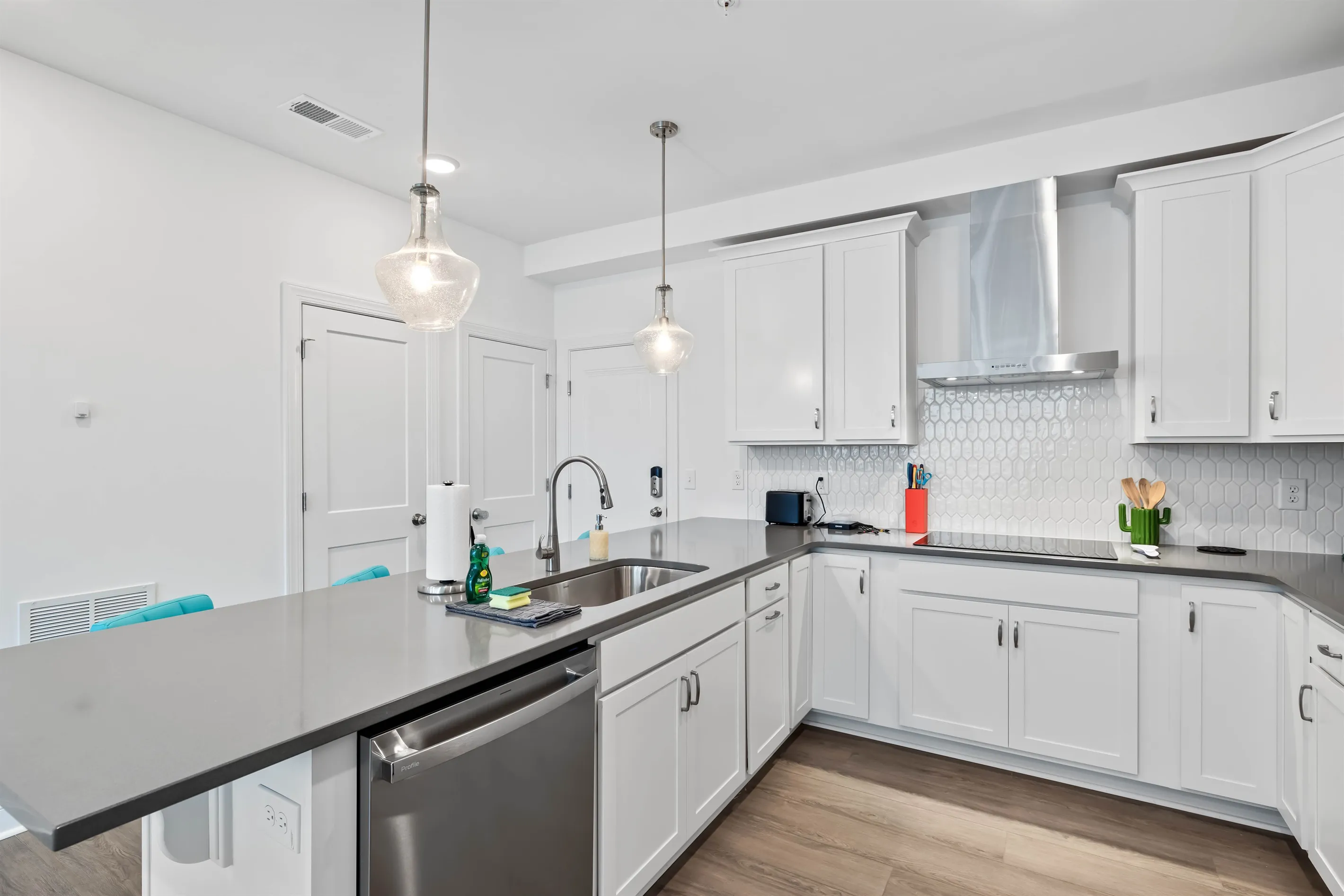 Dishwasher, along with a flat top stove.