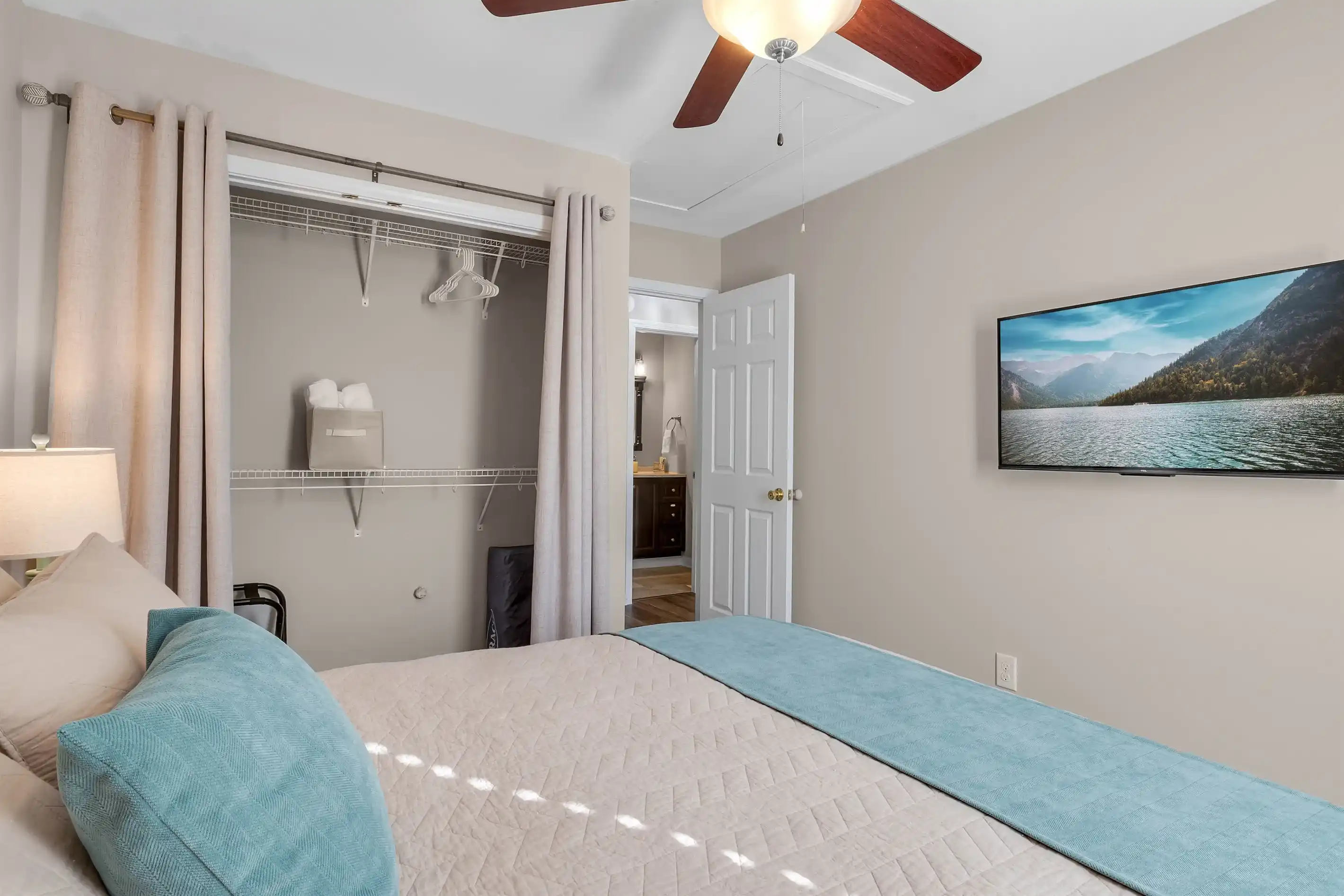 Each bedroom features a wall mounted smart TV, luggage rack and a place for your belongings.