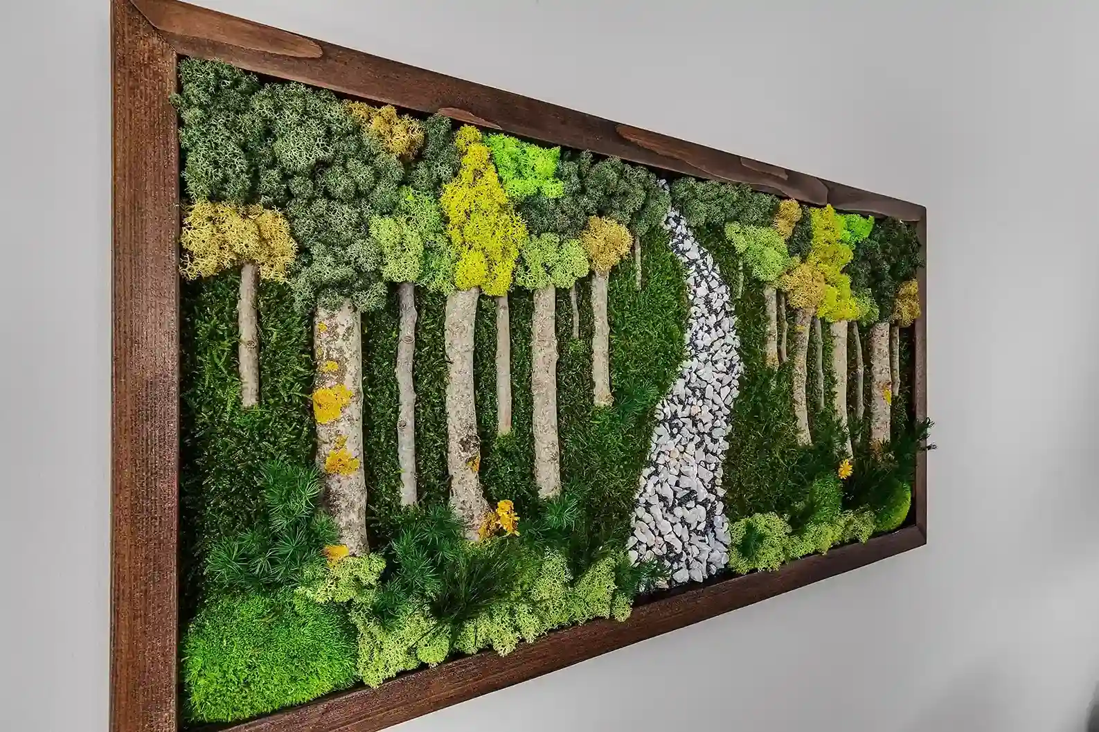Enjoy the rustic modern decor of this house, including this handmade moss art.