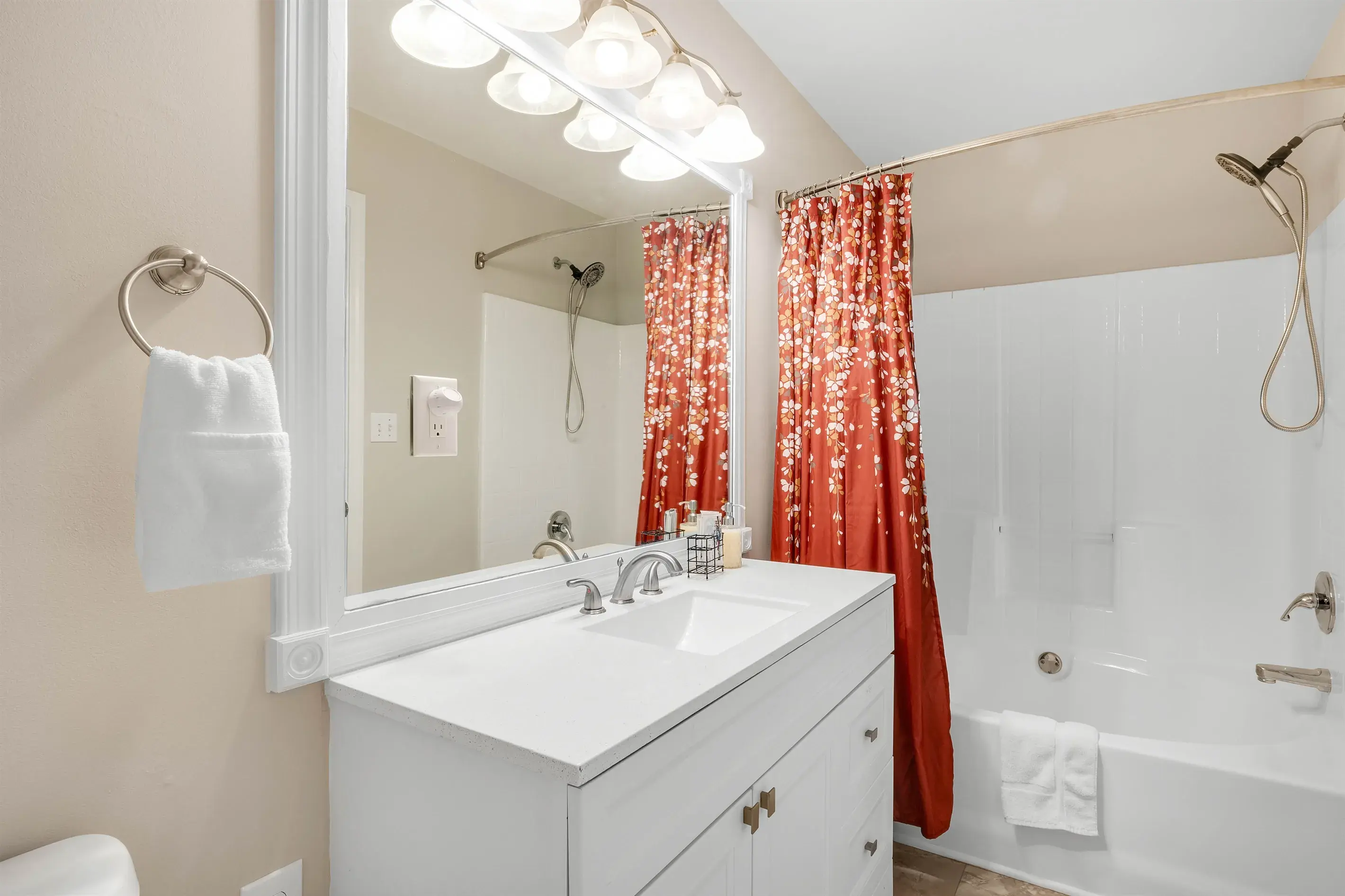 A relaxing bathroom featuring a combination shower and garden tub, perfect for unwinding after a long day.