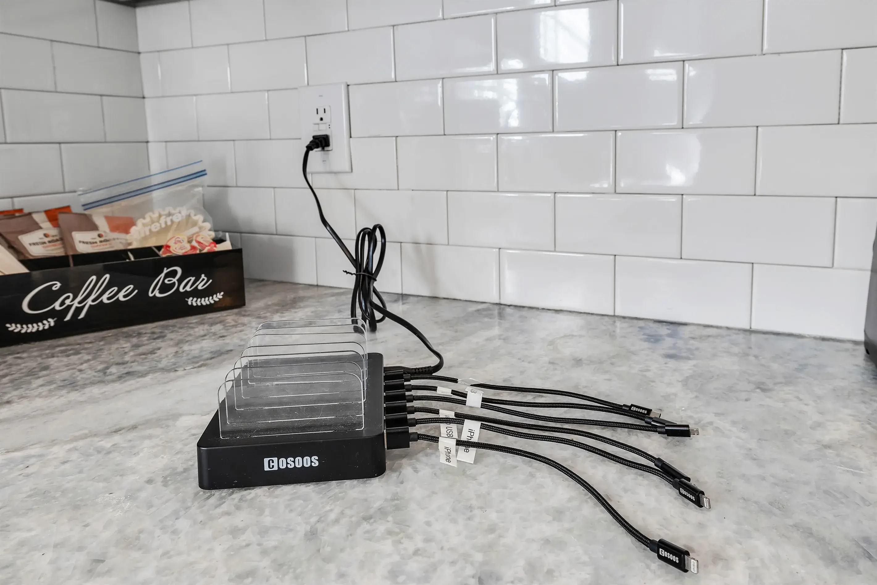 A conveniently placed charging station for everyone. It has chargers for USB C, micro USB and iPhones.