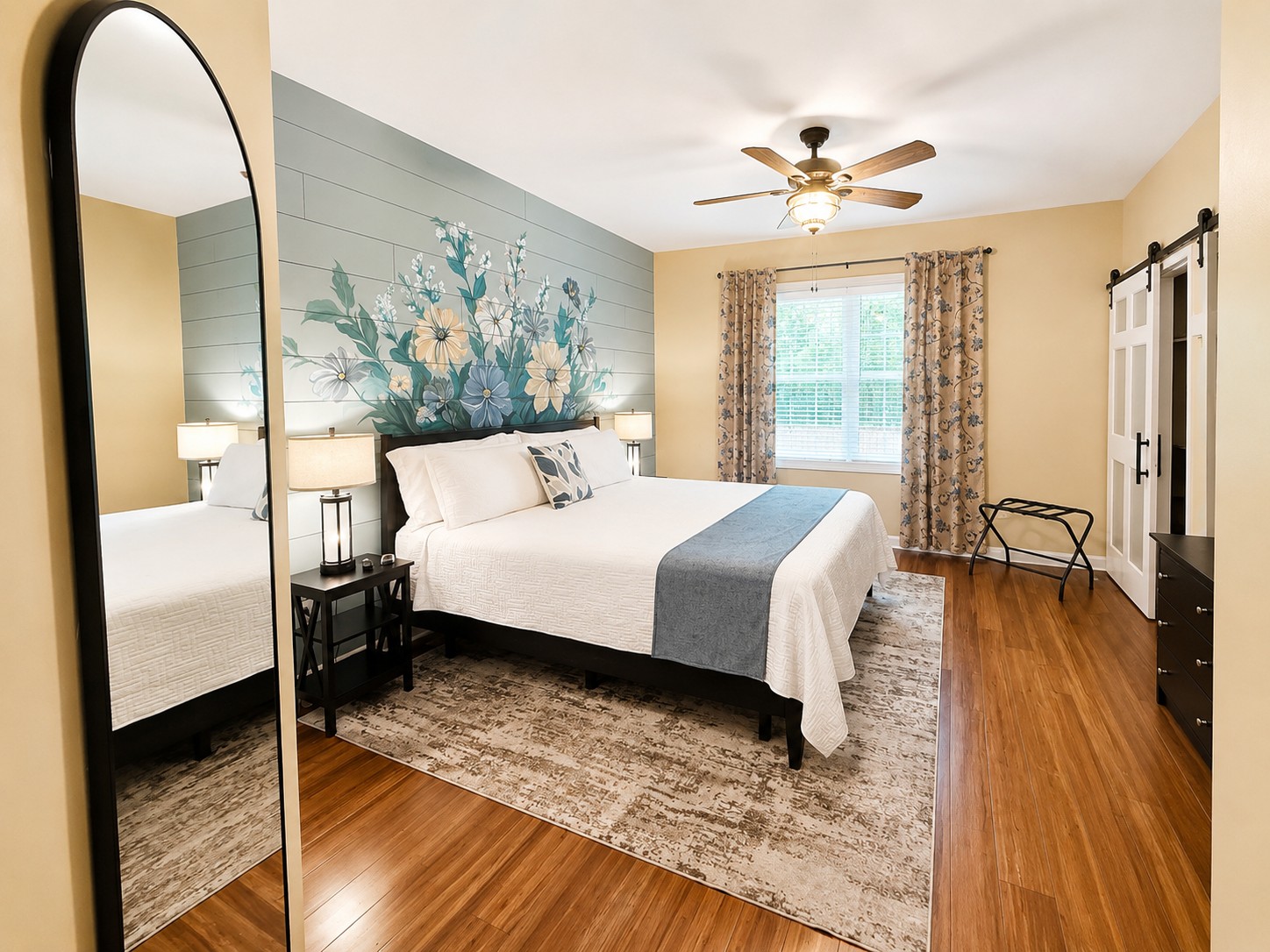 Retreat to the spacious primary suite with a king-size adjustable bed, walk-in closet, and private en suite bathroom.