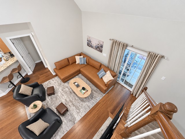 An upstairs view of the open living and dining areas below.